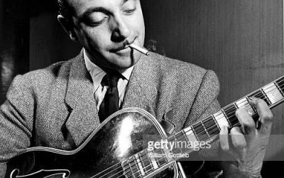 NEW YORK - 1st JANUARY:  Photo of Django REINHARDT (1910-1953) playing his guitar backstage in New York in 1946. (Photo by William Gottlieb/Redferns)